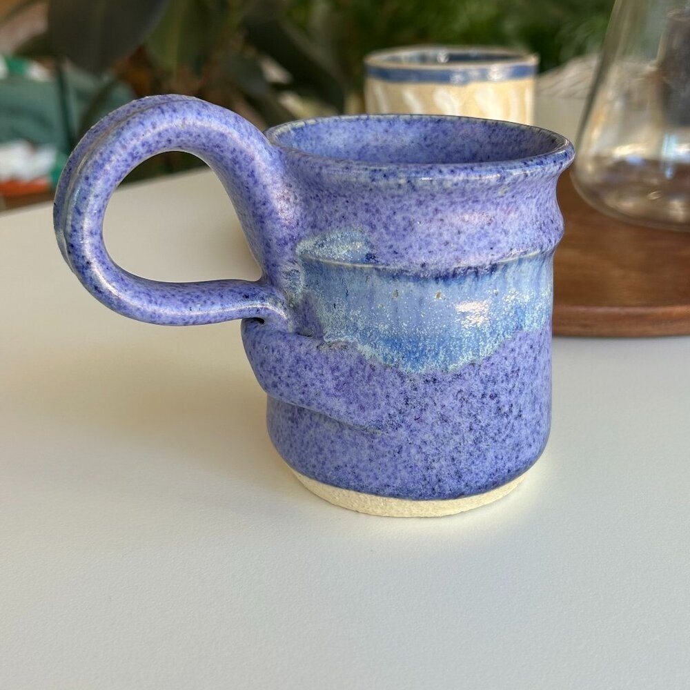 handmade blue ceramic mug with twisty handle